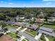 Aerial view of a residential neighborhood with lush trees and clear blue skies on a sunny day at 986 Stonewood Ln, Maitland, FL 32751