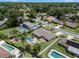 An aerial view of a home featuring a private pool, landscaped yard, and spacious deck at 986 Stonewood Ln, Maitland, FL 32751