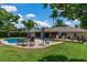 Expansive backyard featuring a pool, patio, and deck, perfect for outdoor entertaining and relaxation at 986 Stonewood Ln, Maitland, FL 32751