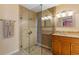 Modern bathroom with frameless glass shower and granite vanity, and modern fixtures at 986 Stonewood Ln, Maitland, FL 32751