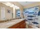 Bathroom featuring a double sink vanity with granite countertop and a shower with a blue fish-themed curtain at 986 Stonewood Ln, Maitland, FL 32751