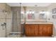 Bathroom showcasing a walk-in shower with glass door and double sink vanity at 986 Stonewood Ln, Maitland, FL 32751