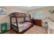 Bedroom showcasing a bunk bed setup with matching dressers and ample natural light at 986 Stonewood Ln, Maitland, FL 32751