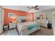 Tranquil bedroom with coral accent wall, white furniture, and plush bedding at 986 Stonewood Ln, Maitland, FL 32751
