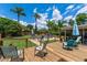 Wooden deck with chairs overlooking the lush backyard, offering a relaxing outdoor space for enjoying the scenery at 986 Stonewood Ln, Maitland, FL 32751