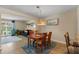 Dining room with a four-chair wooden table and adjacent living room space at 986 Stonewood Ln, Maitland, FL 32751