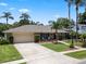 A lovely one-story home with a lush green lawn and mature landscaping for enhanced curb appeal at 986 Stonewood Ln, Maitland, FL 32751