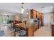 A kitchen featuring granite countertops, stainless steel appliances, a tile backsplash, and eat-in seating at 986 Stonewood Ln, Maitland, FL 32751