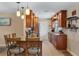 A kitchen featuring granite countertops, stainless steel appliances, tile backsplash, and custom wood cabinets at 986 Stonewood Ln, Maitland, FL 32751