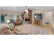Cozy living room with a brick fireplace, comfortable seating, and a view of the backyard at 986 Stonewood Ln, Maitland, FL 32751
