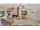 Comfortable living room featuring a brick fireplace and a ceiling fan for a cozy ambiance at 986 Stonewood Ln, Maitland, FL 32751