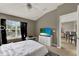 Bright bedroom with vaulted ceiling, large window, and neutral wall color at 6404 S Goldenrod Rd # A, Orlando, FL 32822