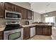 Functional kitchen showcasing stainless steel appliances and ample counter space at 6404 S Goldenrod Rd # A, Orlando, FL 32822