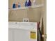 Convenient laundry area with washer, dryer and wire shelving at 6404 S Goldenrod Rd # A, Orlando, FL 32822