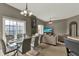 Open-concept living and dining area with sliding glass doors and modern decor at 6404 S Goldenrod Rd # A, Orlando, FL 32822