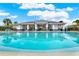 Community pool features seating areas and beautiful architecture offering a great place to unwind at 6404 S Goldenrod Rd # A, Orlando, FL 32822