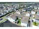 Aerial view of a suburban neighborhood, with orderly rows of modern homes, interspersed with green spaces and community roads at 10183 Peebles St, Orlando, FL 32827