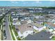 An aerial shot of a modern neighborhood featuring rows of uniform homes with well-kept lawns and paved streets at 10183 Peebles St, Orlando, FL 32827