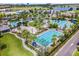 Overhead view of the community pool, clubhouse and recreational facilities including sports courts at 10183 Peebles St, Orlando, FL 32827