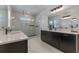 Modern bathroom with glass enclosed shower, double vanity, and stylish fixtures at 10183 Peebles St, Orlando, FL 32827