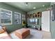 Inviting bonus room featuring hardwood floors, an entertainment center, and ample natural light at 10183 Peebles St, Orlando, FL 32827