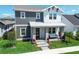 Attractive two-story home featuring modern architectural design, covered porch, and well-maintained landscaping at 10183 Peebles St, Orlando, FL 32827