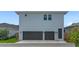 New two-story home with a two-car garage and minimal, yet appealing xeriscaping at 10183 Peebles St, Orlando, FL 32827