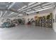 Spacious garage with epoxy flooring, high ceilings, and organized storage solutions for optimal functionality at 10183 Peebles St, Orlando, FL 32827