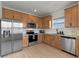 Beautiful kitchen featuring stainless steel appliances, granite countertops, and sleek wood cabinetry at 10183 Peebles St, Orlando, FL 32827