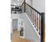 Elegant staircase featuring wooden steps, black iron railings, and a modern design at 10183 Peebles St, Orlando, FL 32827