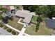 This home features a gray roof, driveway parking and backyard trees at 110 N Alderwood St, Winter Springs, FL 32708