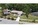 Aerial view of a one-story home with a gray exterior, surrounded by mature trees and landscaping at 110 N Alderwood St, Winter Springs, FL 32708