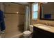 This bathroom features a tiled shower with a built-in bench and a granite vanity at 110 N Alderwood St, Winter Springs, FL 32708