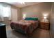 The bedroom features a queen bed with patterned bedding and two nightstands at 110 N Alderwood St, Winter Springs, FL 32708