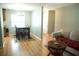 Open-concept living and dining area with hardwood floors and natural light at 110 N Alderwood St, Winter Springs, FL 32708