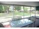 Covered patio with seating and view of the fenced-in backyard at 110 N Alderwood St, Winter Springs, FL 32708