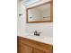 Bathroom featuring dark wood cabinets and a white countertop with a large mirror above the sink at 1122 Washington Ave # 7, Winter Park, FL 32789