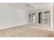 Bright bedroom with carpet and French doors that provide access to the outside at 1122 Washington Ave # 7, Winter Park, FL 32789
