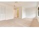 Spacious bedroom with neutral carpet, double closets, and an open doorway to the bathroom at 1122 Washington Ave # 7, Winter Park, FL 32789