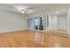 Spacious living room with hardwood floors, fan, and French doors, providing ample natural light at 1122 Washington Ave # 7, Winter Park, FL 32789