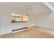 Open-concept space featuring tiled flooring, a serving hatch, and an illuminated ceiling fan at 1122 Washington Ave # 7, Winter Park, FL 32789