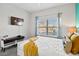 A light-filled bedroom features a bed, side table and streaming entertainment at 1128 Challenge Dr, Davenport, FL 33896