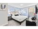 Comfortable bedroom featuring a modern decor, a plush bed, and soft blue color palette at 1128 Challenge Dr, Davenport, FL 33896