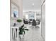 Welcoming entryway leading into a bright living space with a view of the modern dining and living areas at 1128 Challenge Dr, Davenport, FL 33896