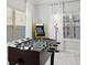 Entertainment room with a foosball table, Pac-Personal arcade game, and natural light from the windows at 1128 Challenge Dr, Davenport, FL 33896