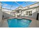 Private outdoor pool with spa and screened enclosure at 1128 Challenge Dr, Davenport, FL 33896