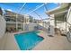 Private outdoor pool with spa and screened enclosure at 1128 Challenge Dr, Davenport, FL 33896