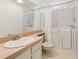 Accessible bathroom features walk-in tub, safety bars, sink and neutral colors at 1243 Tangerine Cir, Lady Lake, FL 32159