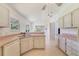 Bright kitchen area with tile floors, ample counter space, and natural light at 1243 Tangerine Cir, Lady Lake, FL 32159