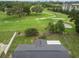 Stunning aerial view showcasing the backyard and the adjacent golf course at 136 Triplet Lake Dr, Casselberry, FL 32707